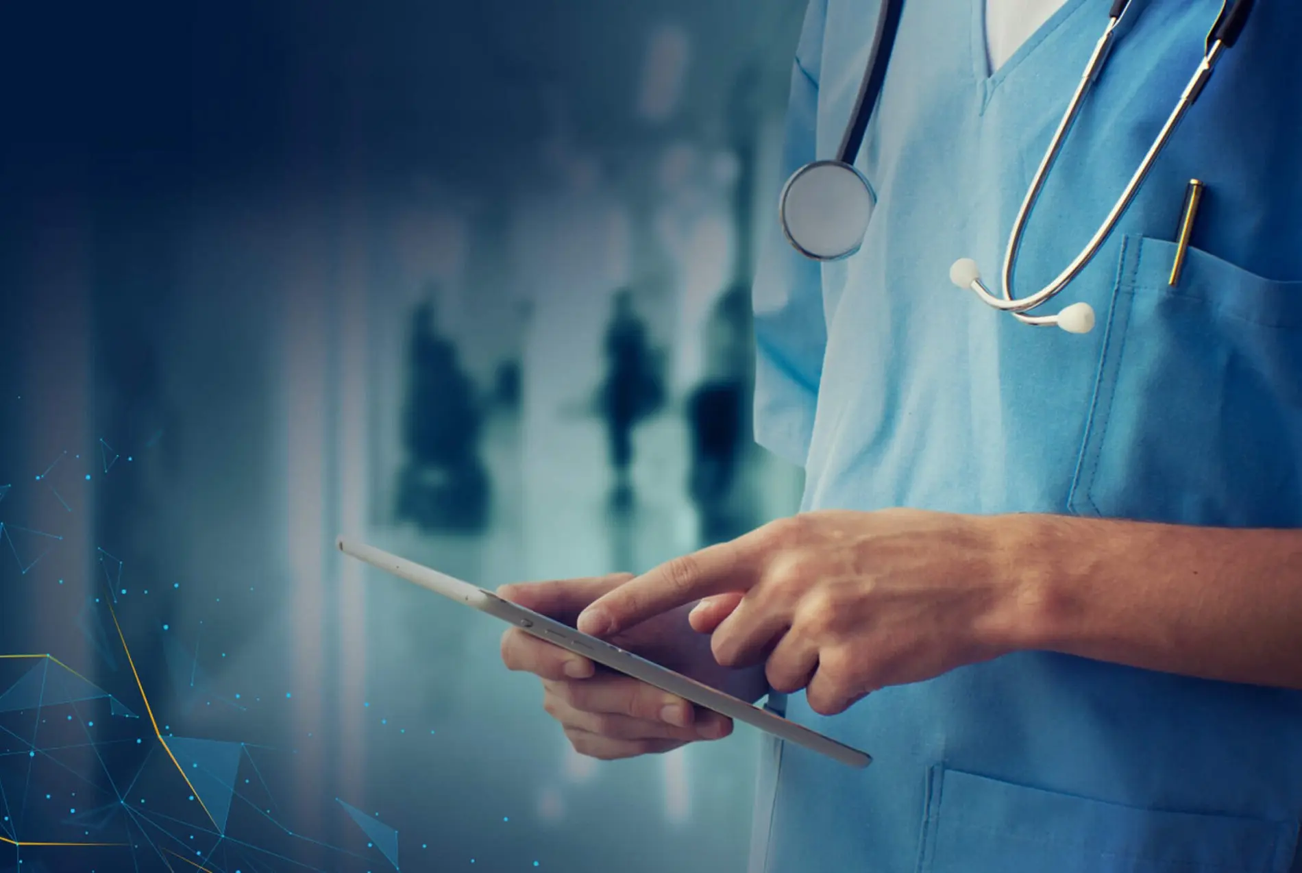 A doctor looking at his tablet